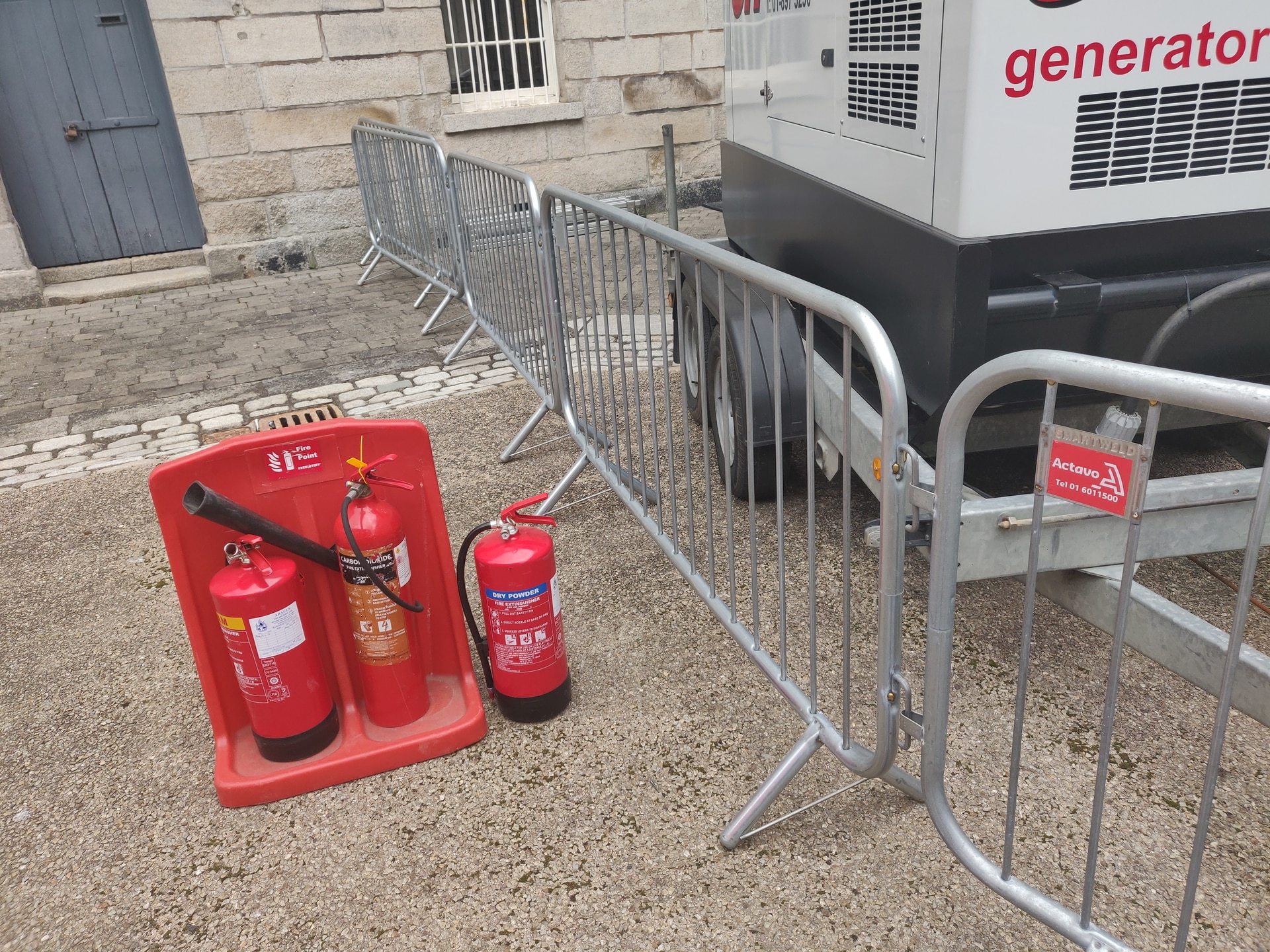 Petrol generator and fire extinguishers at event site